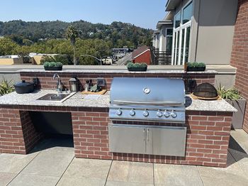 Rooftop bbq area with seating
